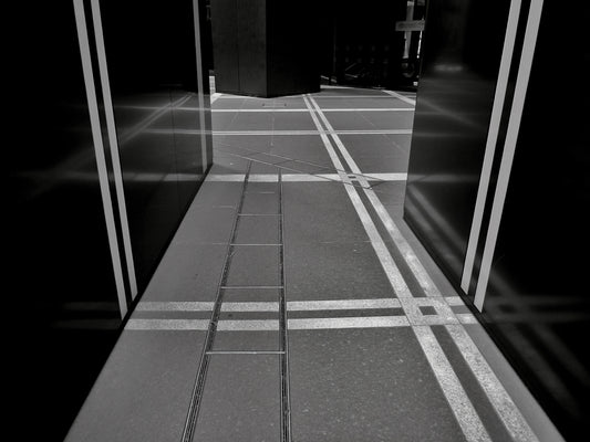 a black and white photo of a hallway