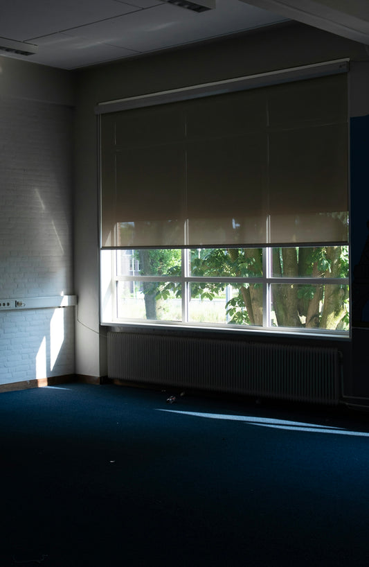 a room with a large window and a radiator