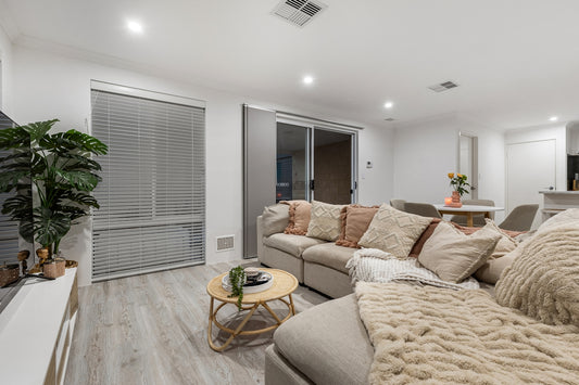 A living room filled with furniture and a flat screen TV