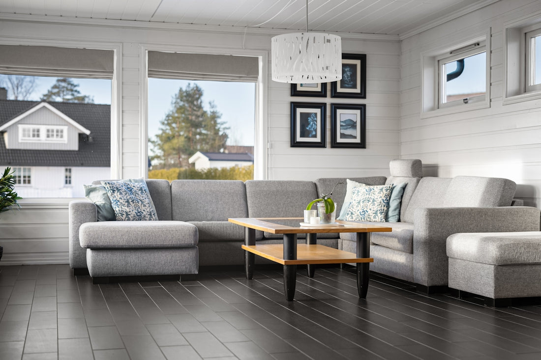 A living room filled with furniture and windows
